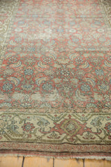 Distressed Hamadan runner detail: visible foundation, faded Herati motif, antique ivory border.