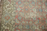 Vintage Hamadan runner's distressed Herati motif, exposed foundation, chestnut, and dusty blue.