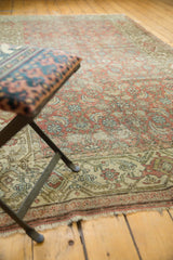 Distressed vintage Hamadan runner, showing worn Herati motifs in muted chestnut, blue, and ivory.