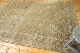 Distressed pile texture and intricate geometric patterns on vintage Shiraz rug border.