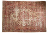 Vintage distressed Persian Meshed rug with starburst medallion, ivory field, raspberry and sand tones.