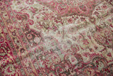 Distressed vintage Meshed rug showing raspberry red floral vines and areas of foundation wear.