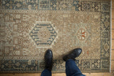 Distressed Karaja runner showcasing geometric vinery, dusty blue, and antique ivory colors.