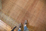 Distressed Sivas rug's Mir Serbend pattern in burnt orange with multi-band powder blue border.