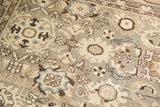 Distressed Malayer carpet showing even wear, faint foundation, and stylized floral motifs.