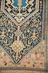 Softened vintage Hamadan rug details: intricate geometric patterns in pale blush, navy, and sky blue.