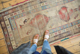Antique Caucasian runner: madder red geometric medallion, natural ivory, powder blue borders, low pile.
