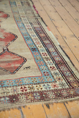 Low pile detail of antique Caucasian runner, powder blue, aubergine geometric border, and animal motif.
