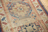 Late 19th century Moghan Kazak runner, geometric gul medallion, hard wear and etching.