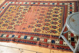 Antique Caucasian rug's central field revealing prominent foundation with pale brick red tones.