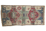Antique hand-knotted Kurdish runner, geometric medallions in maroon, sky blue, and celadon green.