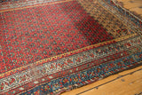 Vintage Kurdish Hamadan rug showing low pile, visible foundation, and intricate borders.