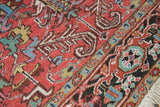 Hand-knotted Mehrivan carpet: cherry red field, elongated serrated leaves, multi-toned border.
