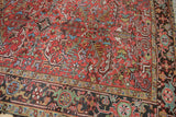 Vintage Mehrivan carpet detail: cherry red field, dramatic serrated leaves, and dark border.