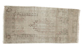Vintage distressed Oushak runner, central serrated medallion, muted ivory, blush, and charcoal, 2'4