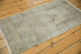 Distressed vintage Oushak runner texture, with low pile and faded blush, charcoal patterns.