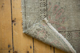 Vintage Distressed Oushak rug runner showing low pile, dusty blush tones, and hand-knotted foundation.