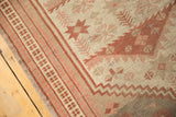 Artfully distressed Vintage Oushak rug with worn pile, geometric border, beige and muted cranberry hues.