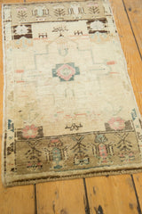 Oushak mat bottom border with germinating planters in brown, blush, and slate blue.