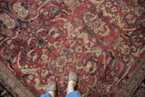 Vintage Mahal carpet's allover red field, showcasing expressive arabesques and elongated leaves.