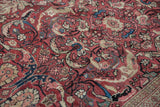 Vintage Mahal carpet with cherry red field, expressive ivory arabesques, and sky blue motifs.