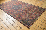 Turkish Sivas vintage carpet perimeter border with dark navy, rust henna plant motif, mostly even wear.