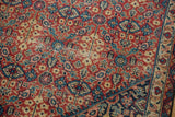 Vintage Sivas carpet with rust, navy, ivory henna plant motifs and mostly even wear.
