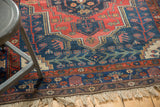 Vintage Kurdish Bijar rug featuring navy and brick red scrolling vinery and visible pile wear.