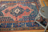 Vintage Kurdish Bijar rug with mostly even wear showing a geometric medallion.