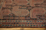 Antique Qashqai rug with geometric paisley boteh pattern, mostly even wear, terracotta and navy.