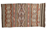 Vintage Turkish Jijim runner with horizontal embossed geometric patterns in warm earthy tones.