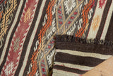 Hand woven Jijim rug with dark brown fringe and striped plain weave reverse.