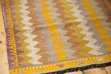 Hand-knotted vintage Jijim rug corner, with gold, ivory, and purple zigzag design.