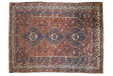 Vintage Persian Shiraz carpet, triple blue medallion on chestnut rust field, floral details.