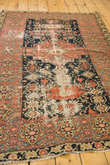 Detailed lower border of the vintage Malayer rug with delicate vinery and varied texture.
