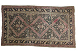 Antique Karabagh carpet with dramatic serrated geometric field, dark aubergine, mauve, and sand, 5'5