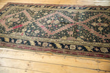 Antique Karabagh carpet corner, dark navy floral main border, aubergine inner border.