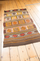 Embossed jijim style embroidery with red serpent elements, tangerine accents, and chocolate brown.