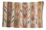 Vintage Turkish Jijim rug, embossed with colorful horizontal bands of orange, yellow, ivory, brown.