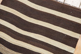Turkish Kilim with striating chocolate brown and ivory oblique bands.