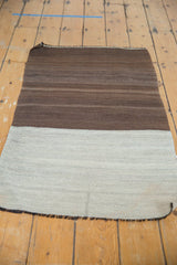 Hand woven Turkish Kilim with striating bands of chocolate brown to silver platinum.
