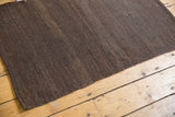 Secured side and natural shorn brown wool variations on the vintage Turkish Kilim rug.