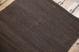 Natural shorn sheep's wool texture, with tone-on-tone chocolate and brown shading.