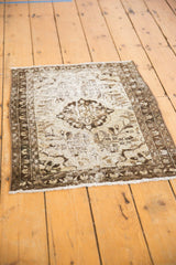 Textured distressed Hamadan rug with faded charcoal, silver, beige, and visible knot heads.