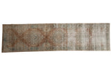 Distressed Kerman runner, unique 'sun-like' floral medallions in pale bronze and faded blue.