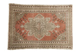 Vintage Distressed Turkish Oushak rug with a central geometric medallion and time-softened tones.
