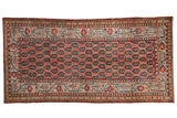 Antique Kurdish rug runner with allover repeating botehs in cinnabar red, ivory, and multi-color blooms.