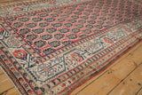 Antique Kurdish rug border featuring intricate geometric designs, blush, ivory, and blue tones.