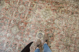 Distressed vintage Mahal carpet texture with worn Herati pattern and visible foundation.
