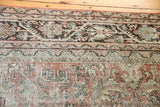 Distressed vintage Mahal carpet detail showing worn pile, exposed knot heads, and Herati motif.